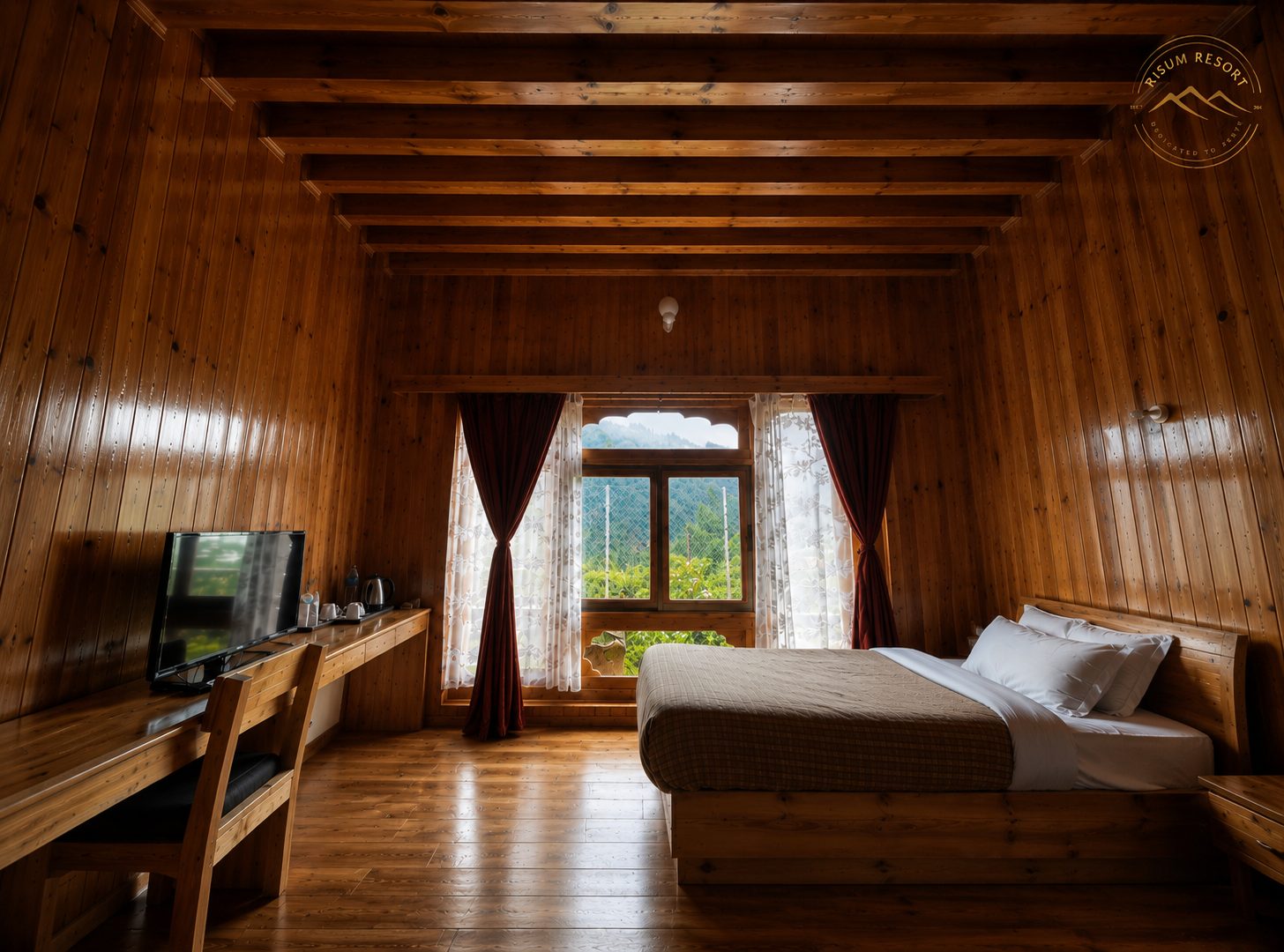 Wood-panelled deluxe room at Risum Resort